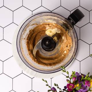 Add butter, fresh lemon juice, and cinnamon to your food processor and blend everything together for 30 minutes. 